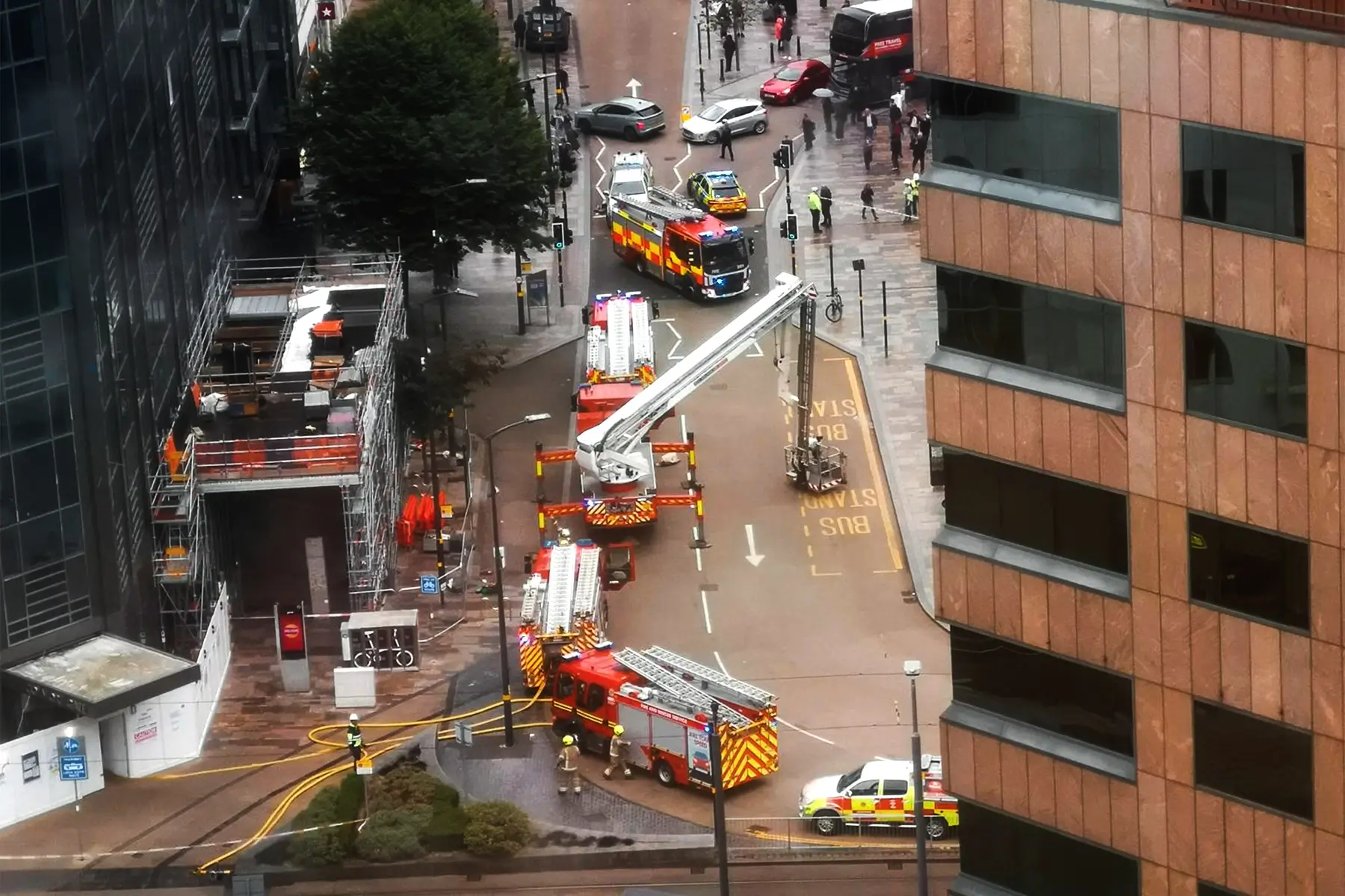 Overhead view of fire engines addressing Renovation Fire Risks at a Birmingham construction site.